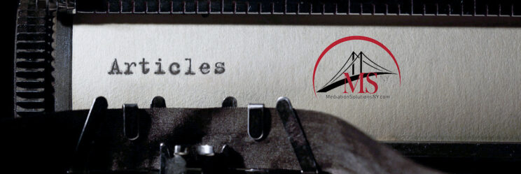 Typewriter showing paper with the word "Articles" typed onto it